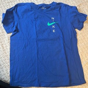Nike Men's Blue Tee with Green Logo